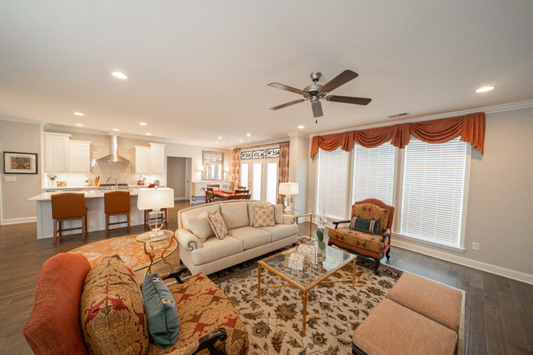 Living room with red and tan decor