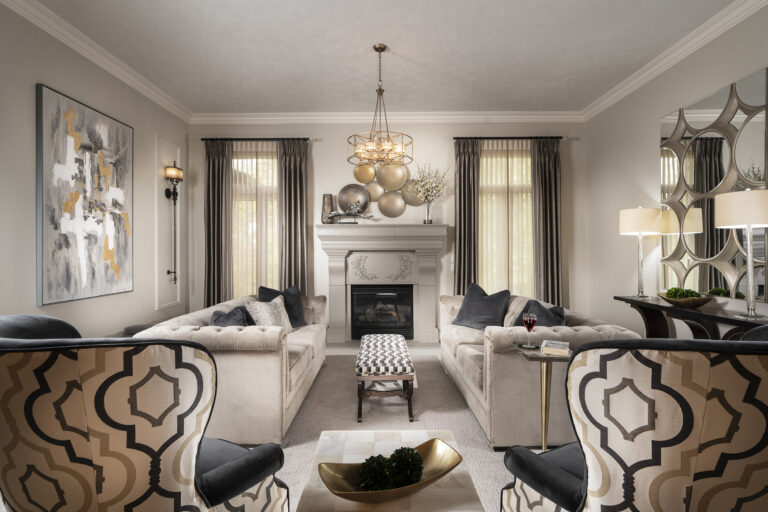 White and black living room arranged around a beautiful fireplace